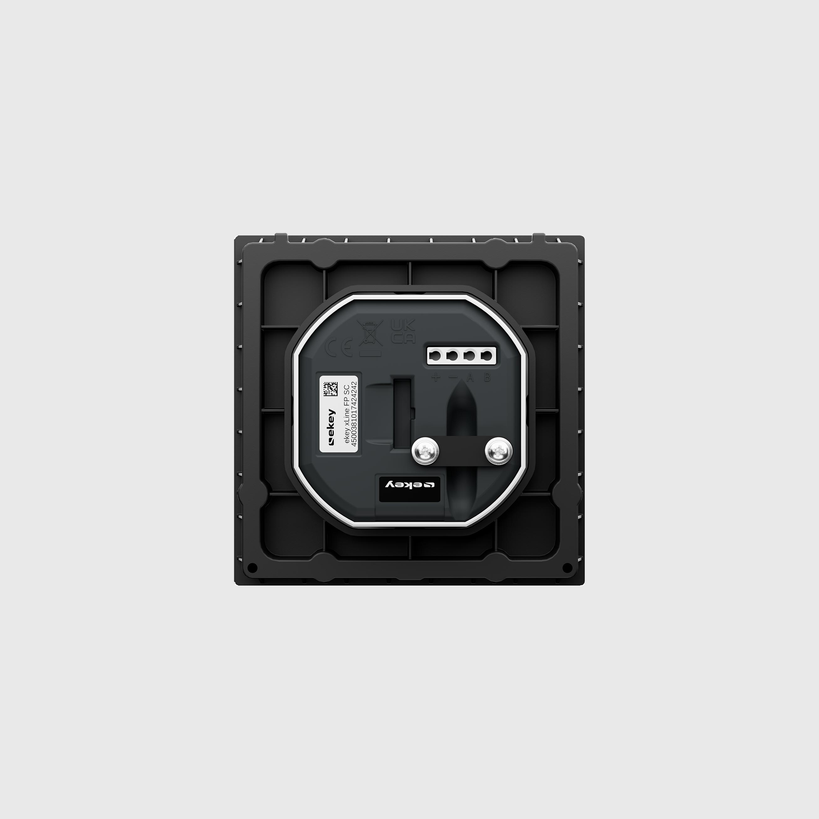 Quadratisches elektronisches Gerät mit Anschlussbuchsen und Schrauben in schwarzem Rahmen